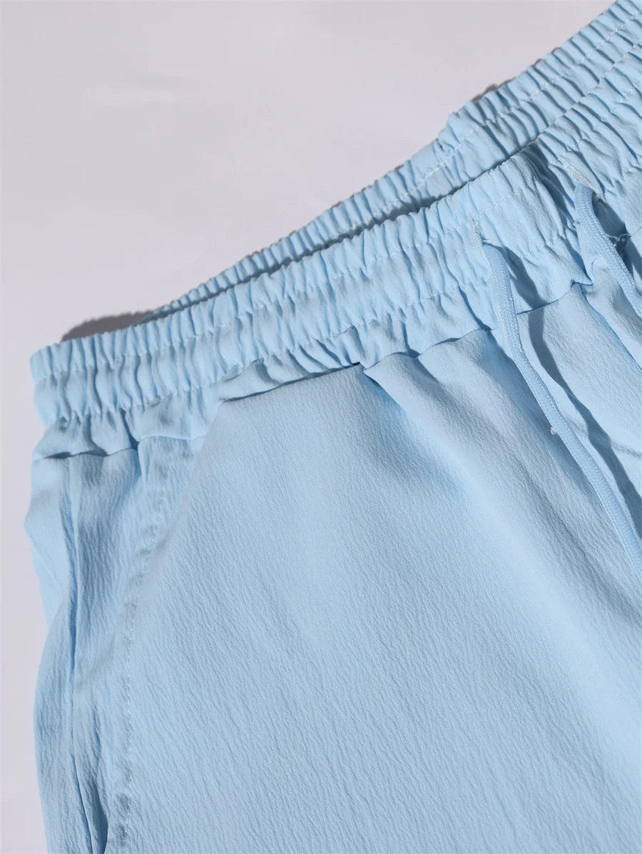 Novo verão 2 peças casual todos os dias lapela shorts conjunto havaiano cor sólida sem mangas camisa masculina praia shorts