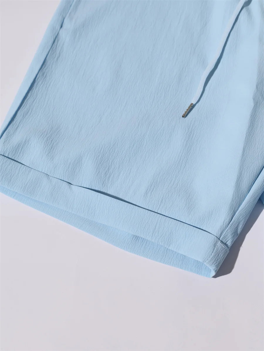 Novo verão 2 peças casual todos os dias lapela shorts conjunto havaiano cor sólida sem mangas camisa masculina praia shorts