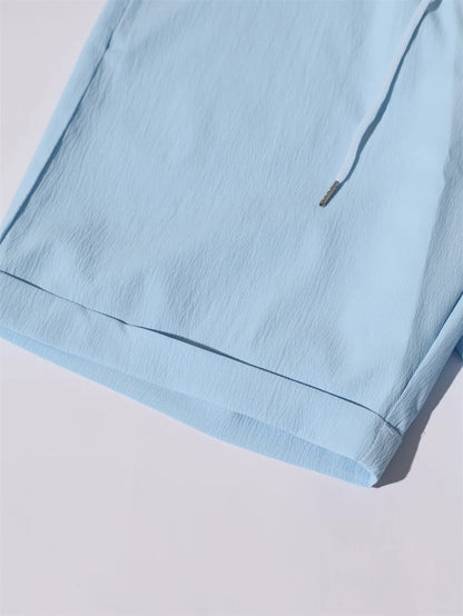 Novo verão 2 peças casual todos os dias lapela shorts conjunto havaiano cor sólida sem mangas camisa masculina praia shorts